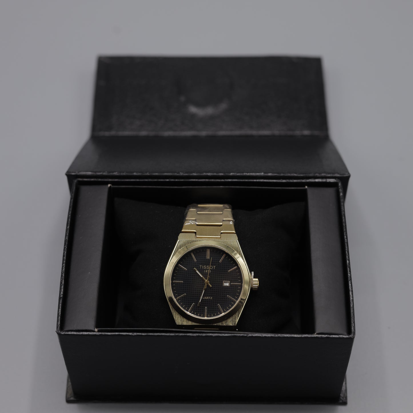 Tissot PRX Yellow Gold Black Dial Quartz Watch.